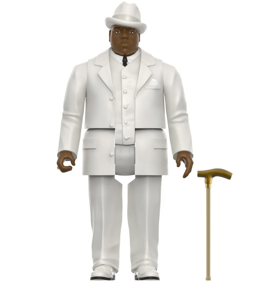 Biggie action figure dressed in his iconic white suit and hat along with a gold-handled cane accessory.