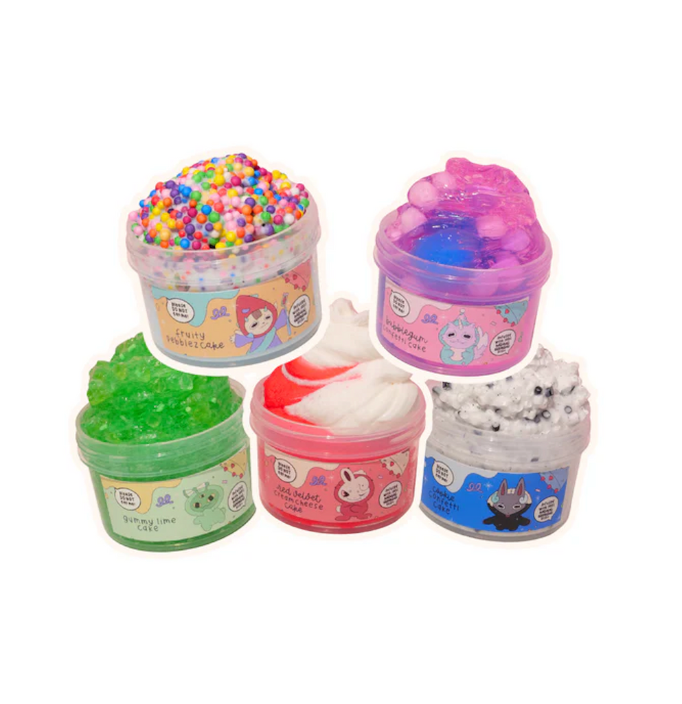 Set of five colorful Birthday Beasts slime containers overflowing with each flavor of slime. 