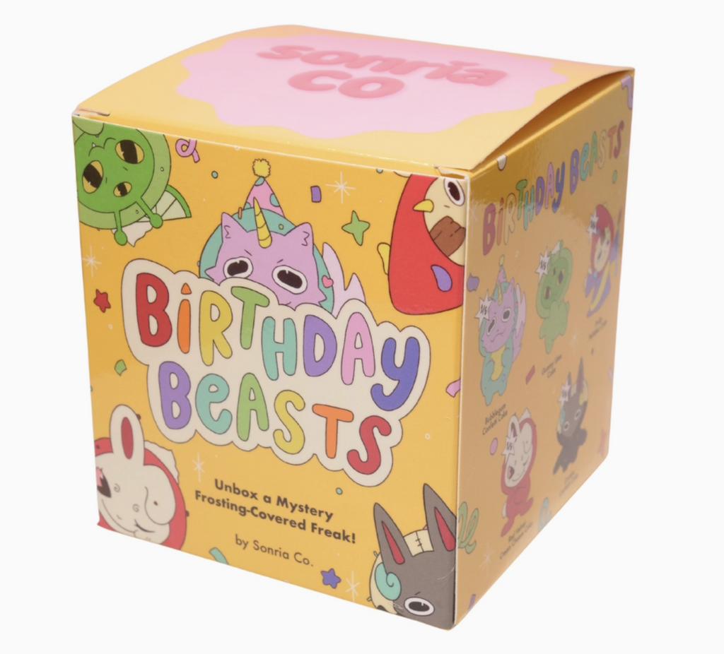 Yellow box with illustrations of the Birthday Beasts characters all over the front and sides. Birthday Beasts is also written on the front in colorful lettering. 