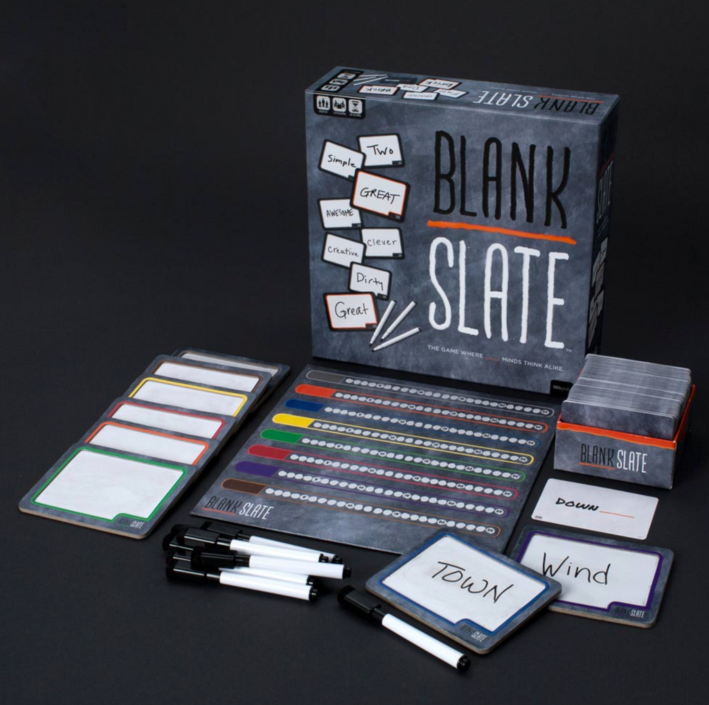 Blank Slate game box with all playing pieces on a table.