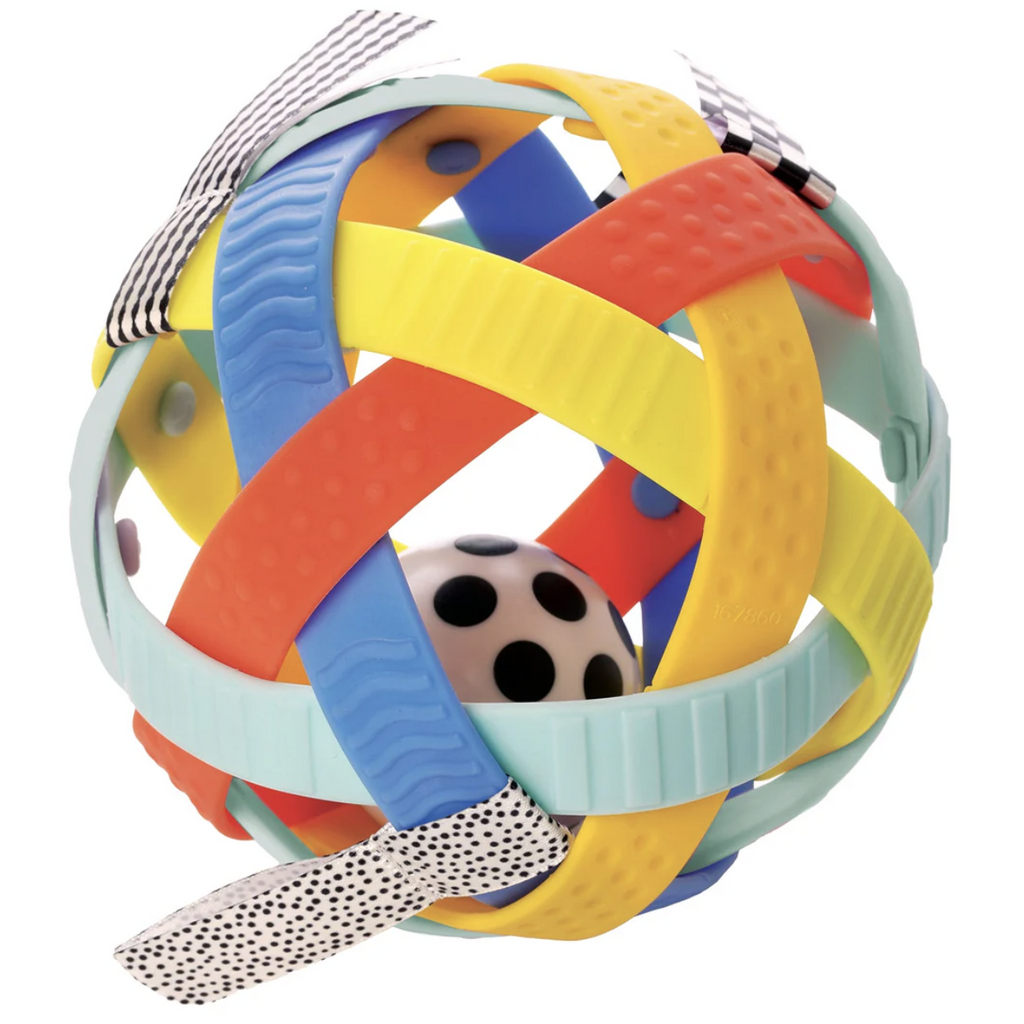 The Blissful Ball with colorful, textured, bendable plastic bands with textured black and white ribbons attached to various bands. There is also a smaller  ball inside that is white with black polka dots. 