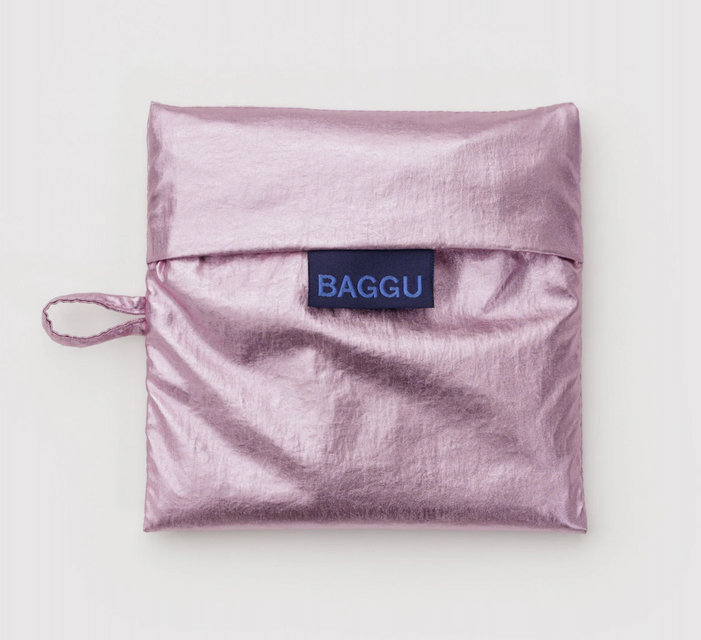 Metallic Blush Standard sized Baggu folded into it's matching flat storage pouch. 