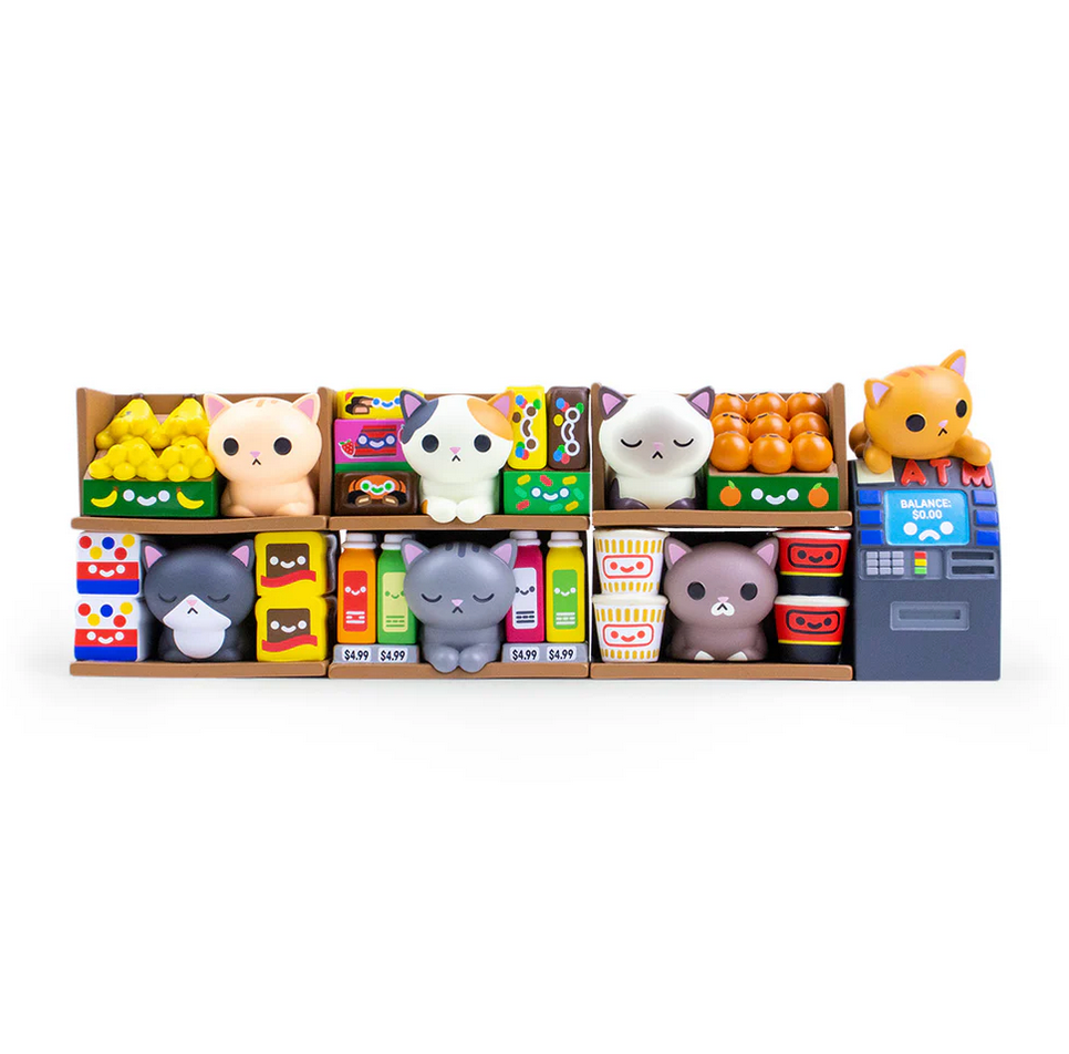 Image of the 7 different Bodega Cat vinyl figures in the series. Most are cats sitting in an open shelf with various food items around them, one is a cat on top of an atm machine.