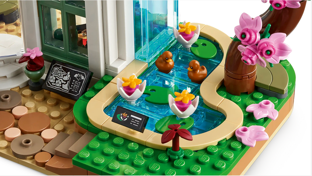 Close up detail of water lily pond with ducks from the Lego Friends Botanical Garden set.