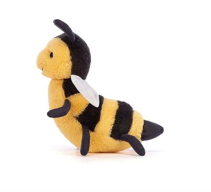 Side view of Brynlee Bee showing off her sheer white wings and black and yellow striped body. 