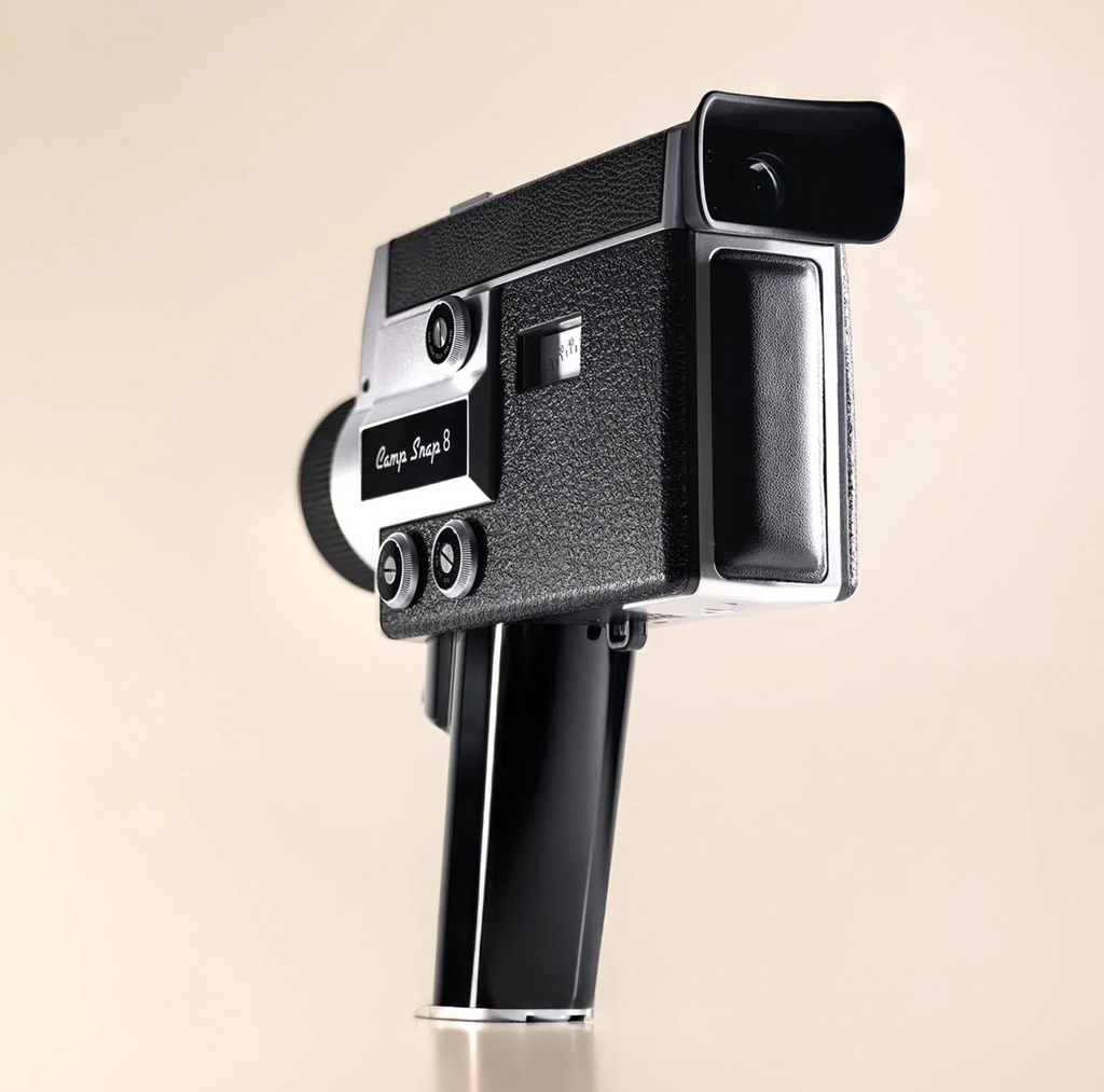 Vintage-style camera on a beige background