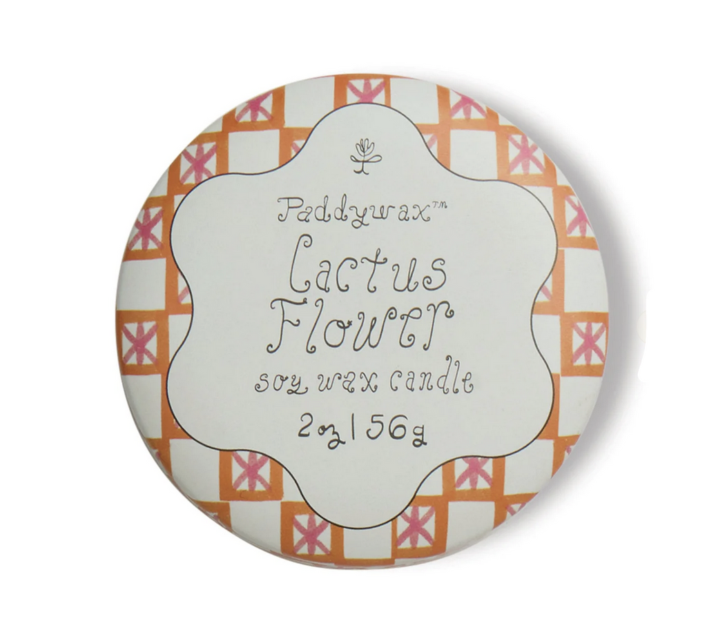 Top of the tin lid that covers the Cactus Flower scented candle by Paddywax. 