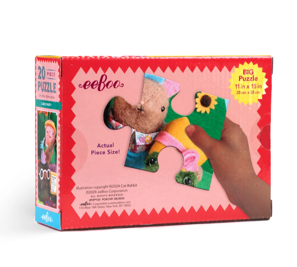 Back of Cake Party 20 piece puzzle box shows a child's hand holding one oversized puzzle piece.
