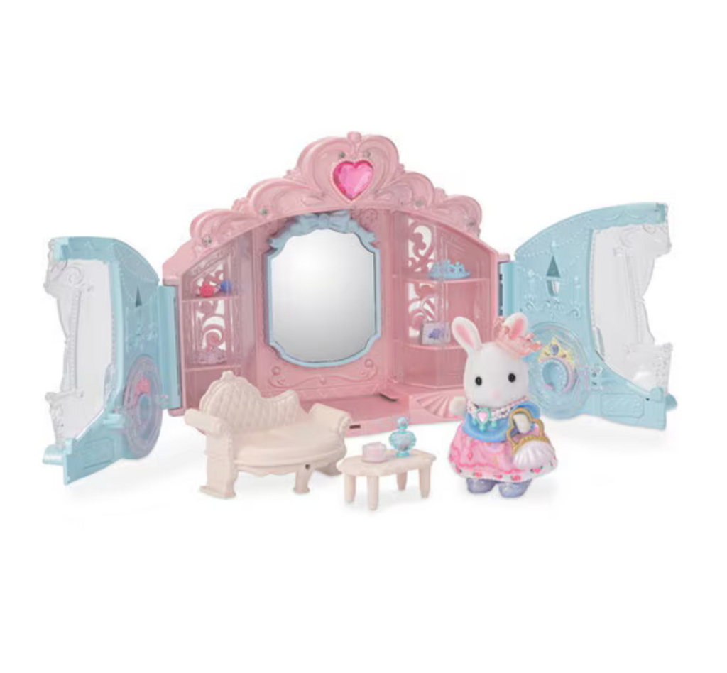 A Carriage that turns into a dressing room, furniture, accessories and the rabbit figurine from the Style and Sparkle Dressing Room Set from Calico Critters. 