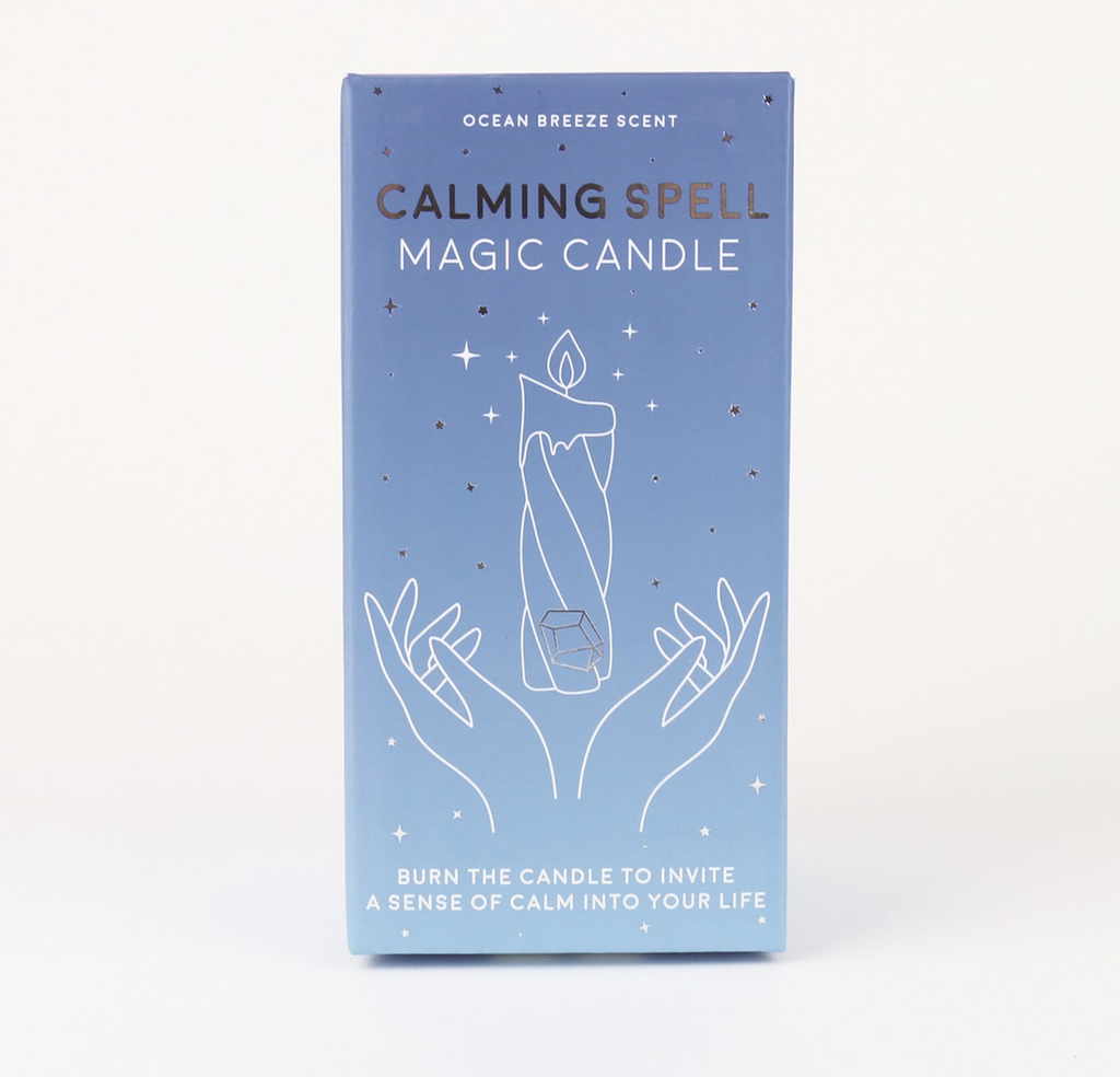 Calming Spell Magic Candle box with intricate designs on a blue box with gold accents. 