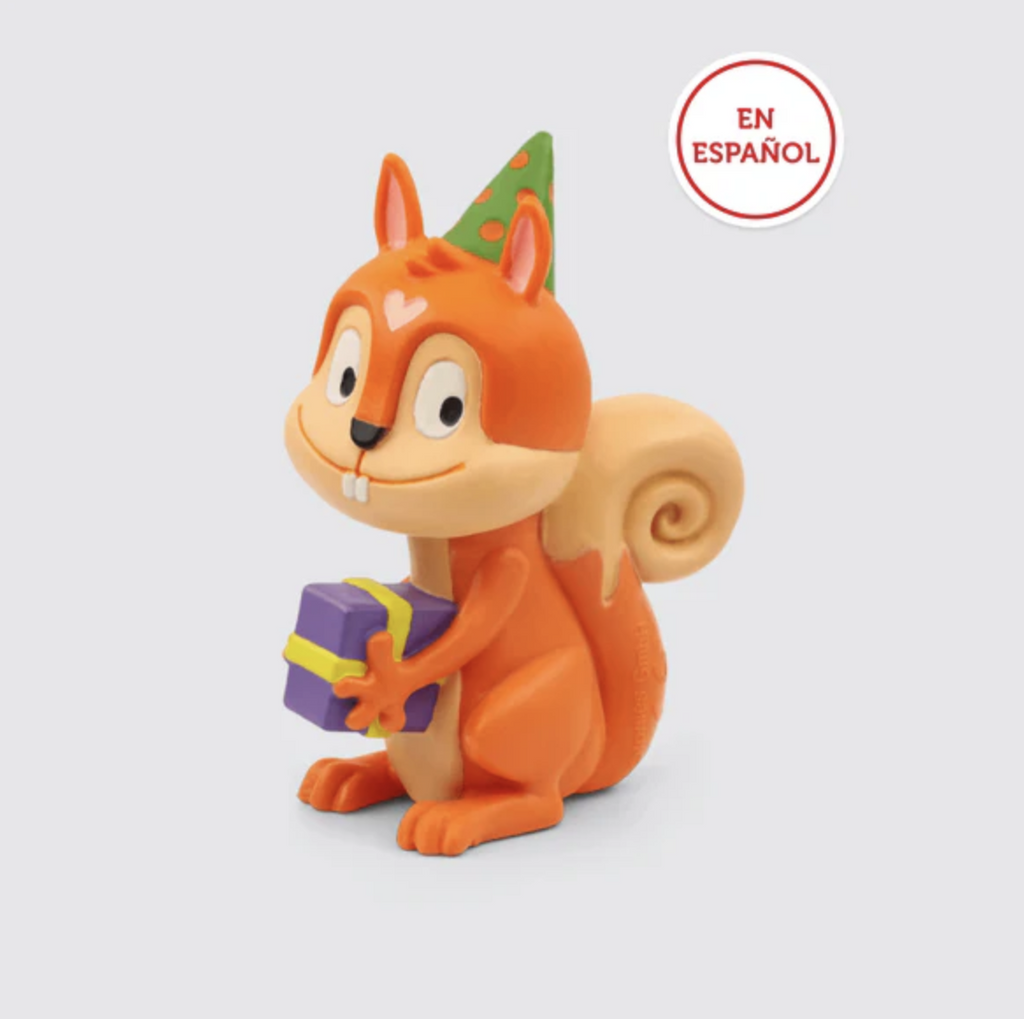 Red squirrel Tonie figure is wearing a green party hat while holding a purple wrapped gift. Text reads En Espanol.