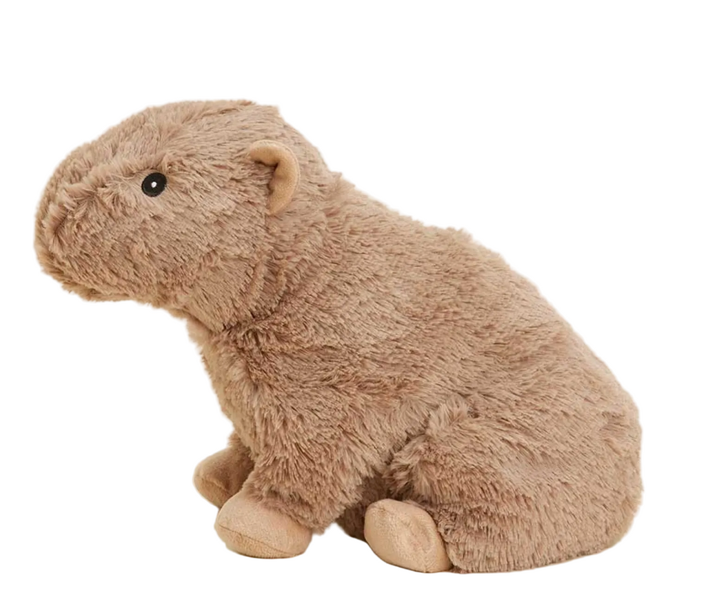 Side view of the Capybara Warmies weighted plush. 