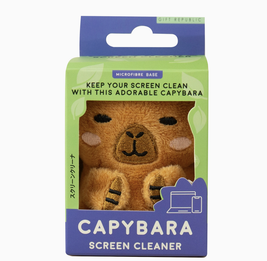 The adorable Capybara Screen Cleaner, a little plush animal that doubles as an electronics screen cleaner packaged in an open green and blue box. 
