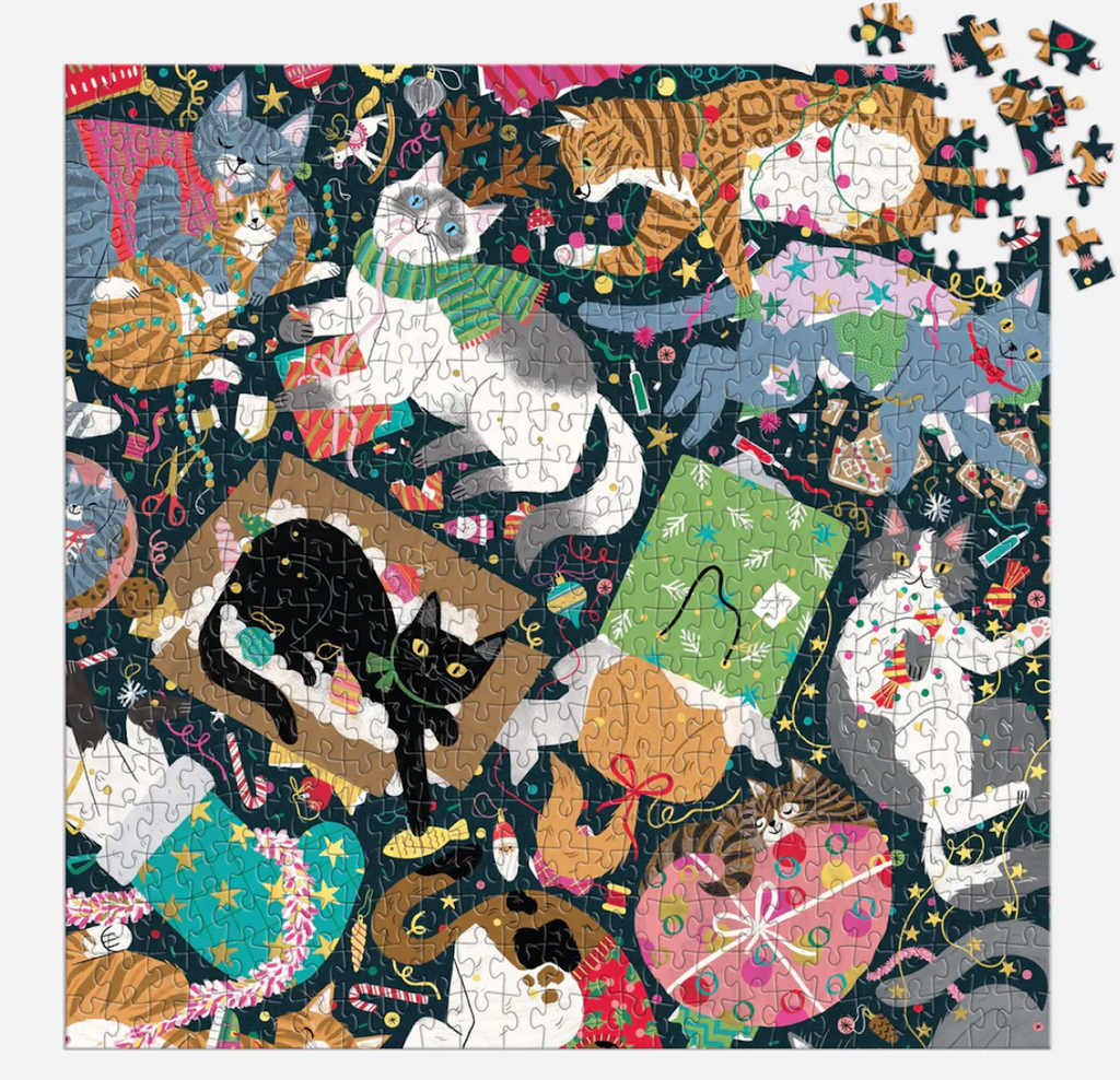 Jigsaw puzzle with holiday cat-themed design with foil accents. 