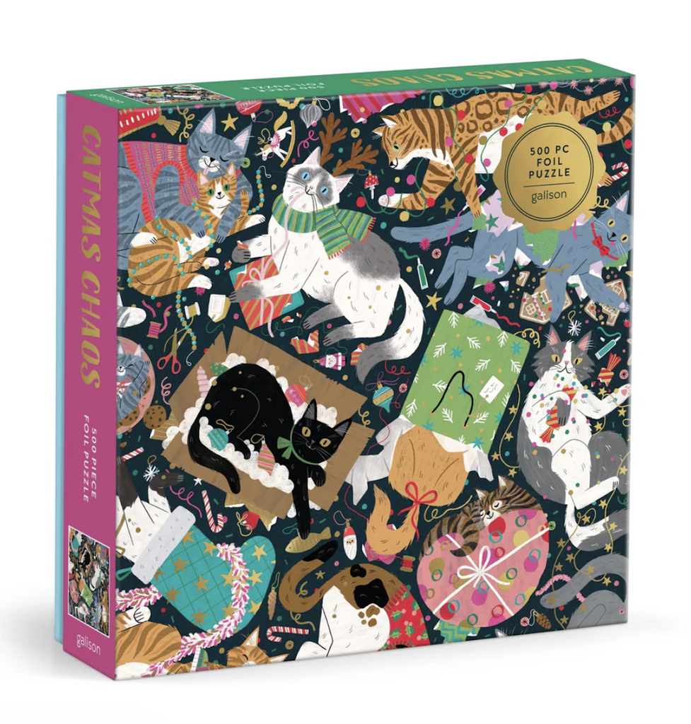 Square box with cover art featuring the same graphics as the the Catmas Chaos 500 piece puzzle. With illustrations of cats creating all kinds of holiday mischief with gold foil accents. 