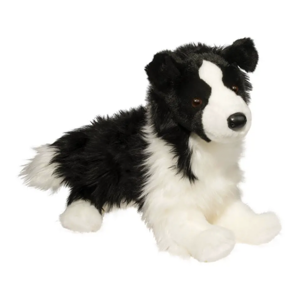 Black and white plush border collie dog. 
