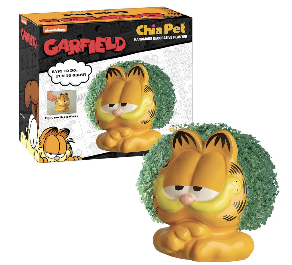 The ceramic Garfield Chia Pet planter with a full head sprouts and the box with a color picture of the Garfield Chia Pet on the front. 