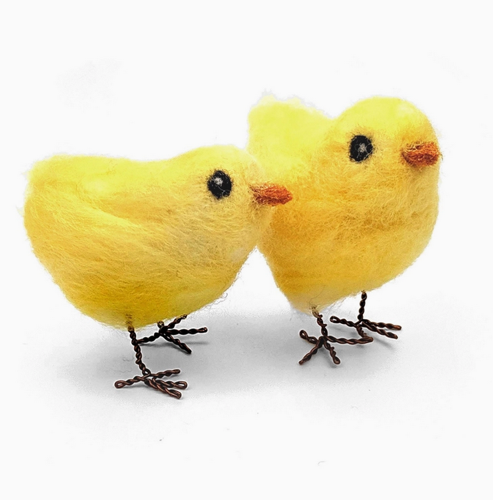 Two bright yellow felted baby chicks with wire feet, made from the Chirpy Chicks Needle Felting Craft Kit. 