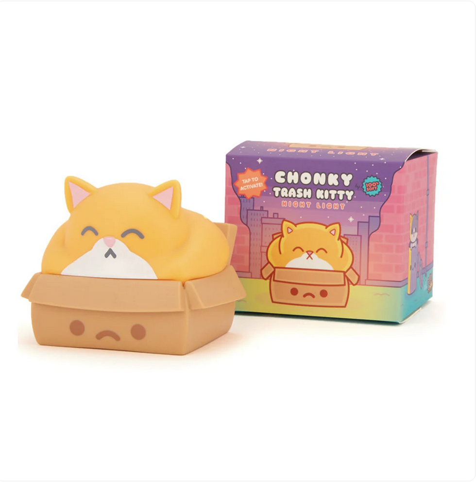 Chonky Trash Kitty night light. Vinyl orange and white overweight cat with eyes closed sitting in a brown box with a sad face on the side.
