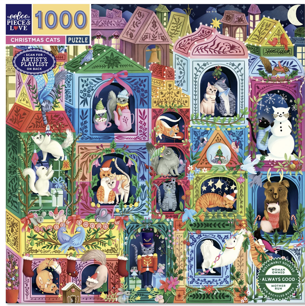Box cover for the Christmas Cats 1000 piece puzzle featuring a peek into the world of all kinds of cats celebrating the holidays in their homes. 