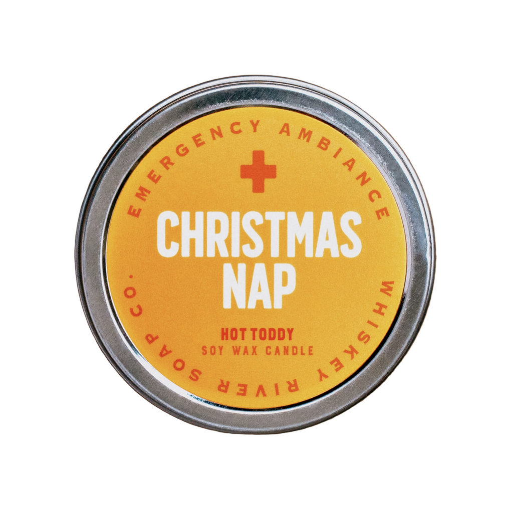 Round candle tin with text that reads Christmas Nap Hot Toddy soy wax candle.