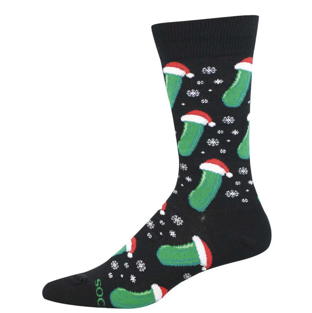 Black socks with snowflakes and bright green pickles wearing Santa hats. 