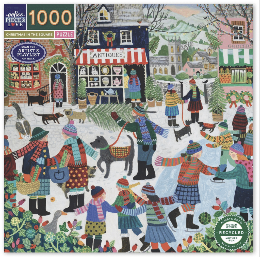 Cover of the Christmas In The Square jigsaw puzzle with a festive scene of villagers bundled up and enjoying the holiday season with ice skating, choosing a Christmas tree, and shopping. 