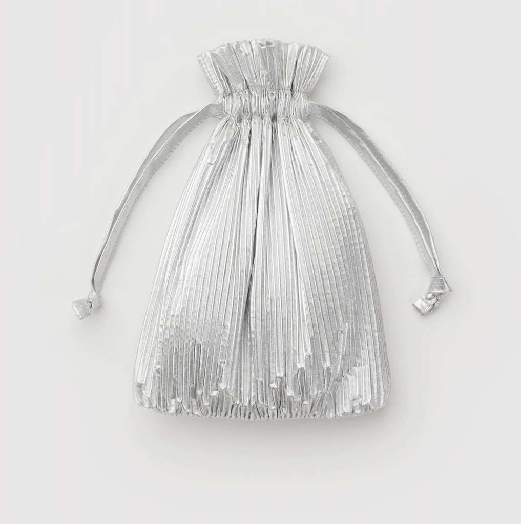 Baggu Pleated Metallic Chrome bag stored in the matching drawstring pouch. 