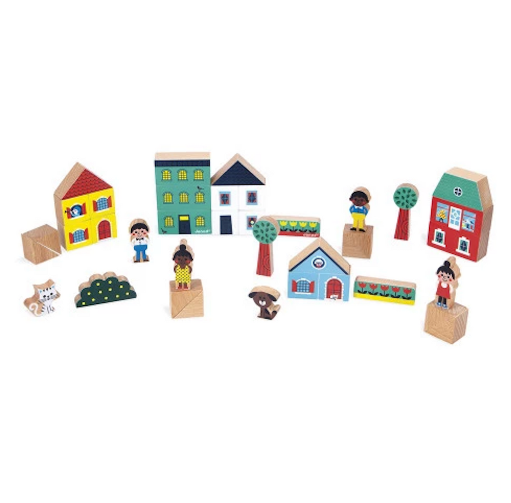 Set of wooden toy blocks that make up colorful houses, people and animal figures. 