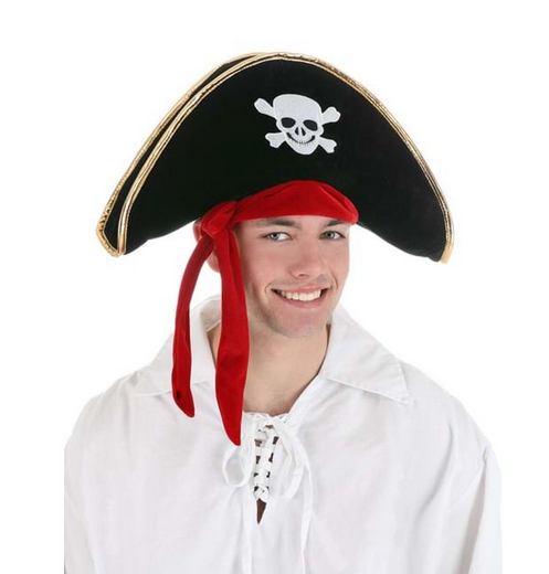 The Classic Pirate Hat with an appliqued skull and crossbones on the front and a metallic gold edge binding. The sewn-on scarf can be tied as desired on the right hand side. Pictured here being worn by an adult. 