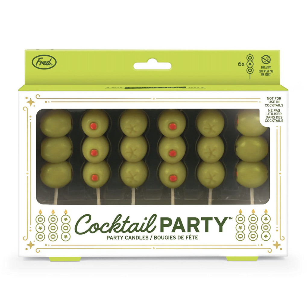 White and green box with gold foil accents that has an open window at the front showing the Cocktail Party candles each stacked with three pimento stuffed green olives. 