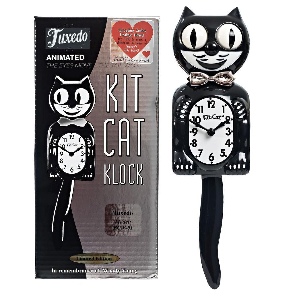 Retro Kit Cat Clock in limited edition colors with ivory clock face, mouth and chrome bow tie. 