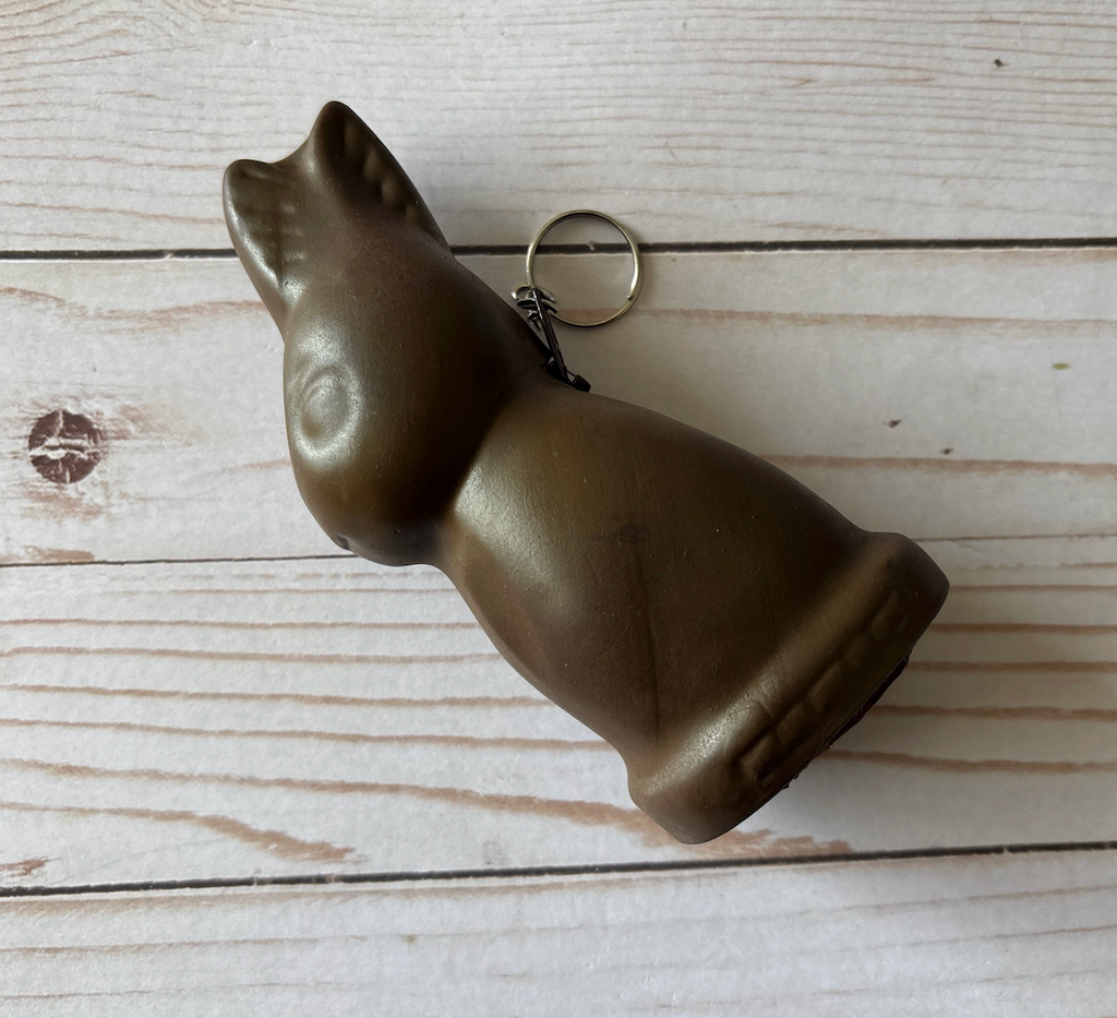 Chocolate bunny shaped coin purse with zipper closure at the back and silver keyring attached. 