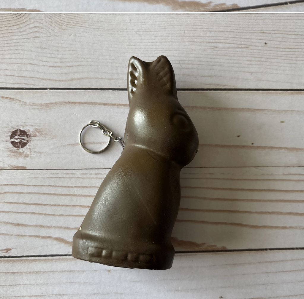 Classic chocolate bunny shaped coin purse with a silver keyring attached. 