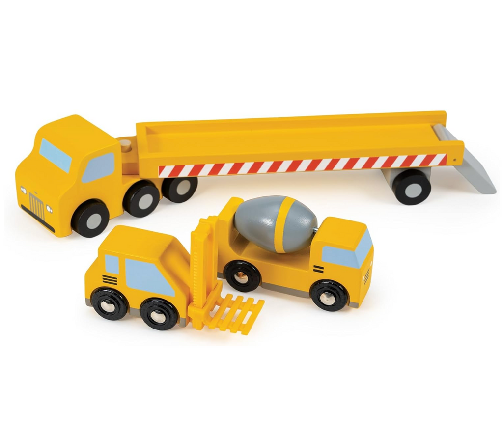 Wooden toy construction vehicles including a flatbed transporter  truck and a cement mixer on a white background. 