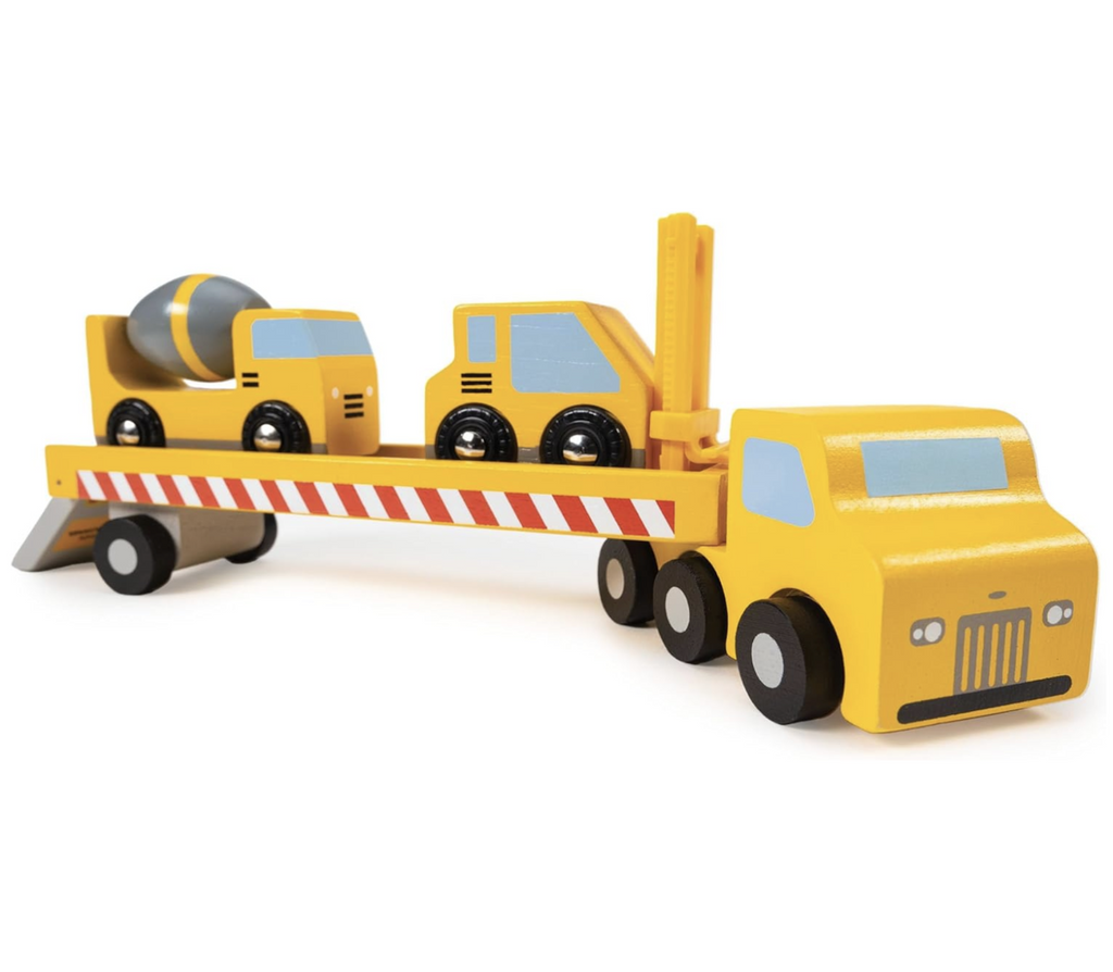 Wooden construction vehicle transporter truck with a cement truck and heavy lifter truck loaded up and ready to go to the next job site!