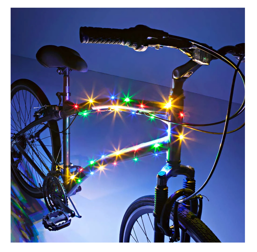 Bicycle with colorful LED lights against a dark background