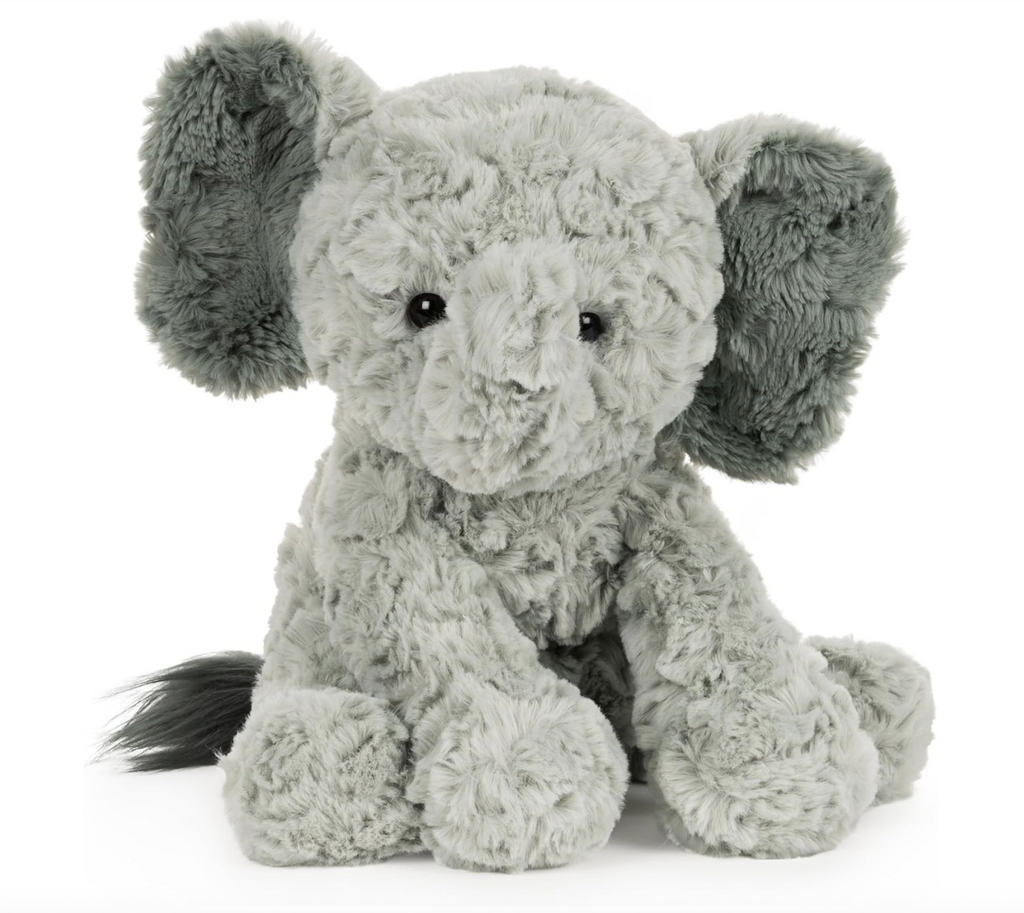 Scruffy, plush elephant in an upright seated position. 