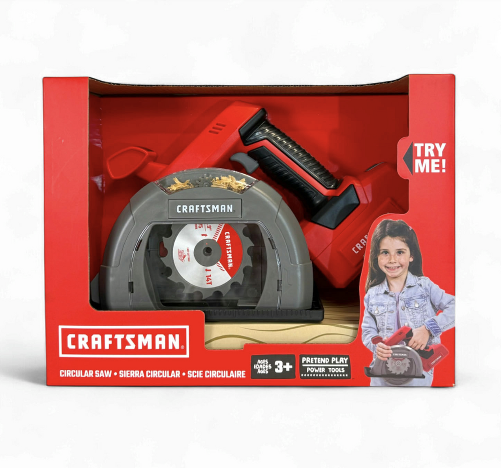 The Craftsman Battery Powered Circular Saw toy packaged in a red, open box that displays the toy circular saw with a try me function that shows off the sounds and light that mimic the experience of using a real circular saw. 