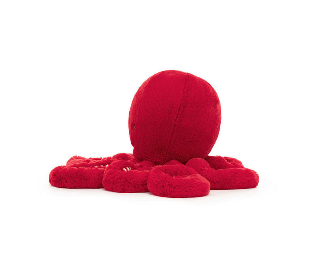 Side view of the Large Cranberry Octopus stuffed animal from Jellycat. 