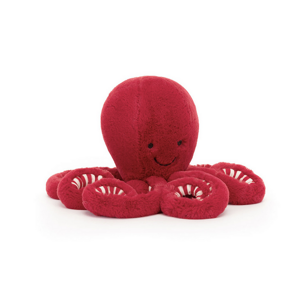 Cranberry Octopus plush with candy cane swirls on the inside of it's tentacles. 