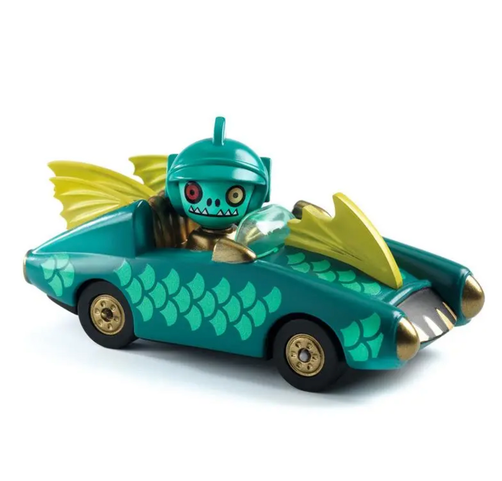 Diecast car with convertible styling and fins painted on the sides and hood. There is also a yellow fin in the center of the hood and two on the trunk. The driver is wearing a green helmet with fins.
