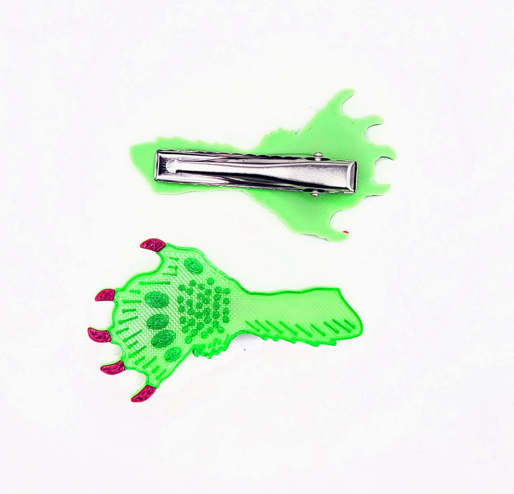 Creature Claws 3D Printed Clips showing the green claw with red nails of the top of the clip and the bottom alligator clip.