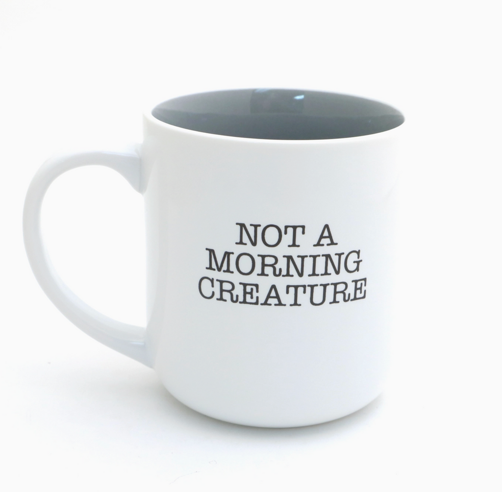 White stoneware mug with 'Not a Morning Creature' text in black. 