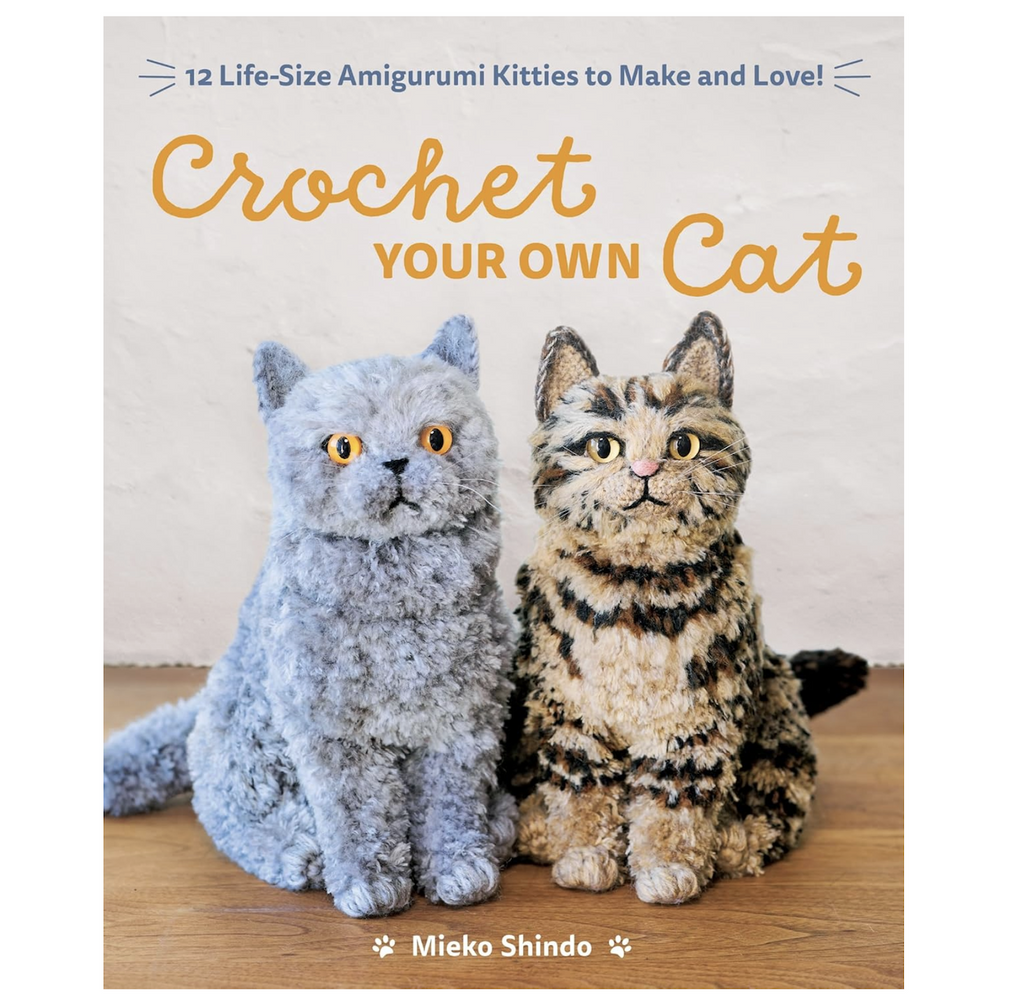 Cover of the Crochet Your Own Cat book that explains exactly how to create 12 life size Amigurumi kitties. The cover features a picture of two kitties that were constructed using the Amigurumi method. 