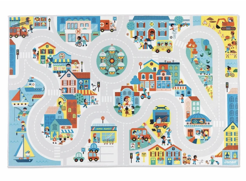 The Cross Roads City Playmat viewed from above so that the neighborhoods and streets around this make believe city are clearly visible. From the coast to the city center and beyond this city is full of busy people. 