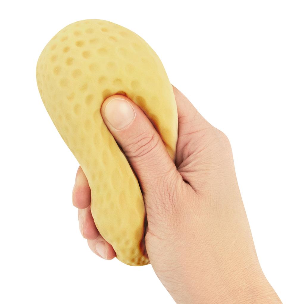 A hand holding and squeezing the Crunchy Peanut Squishy toy. 