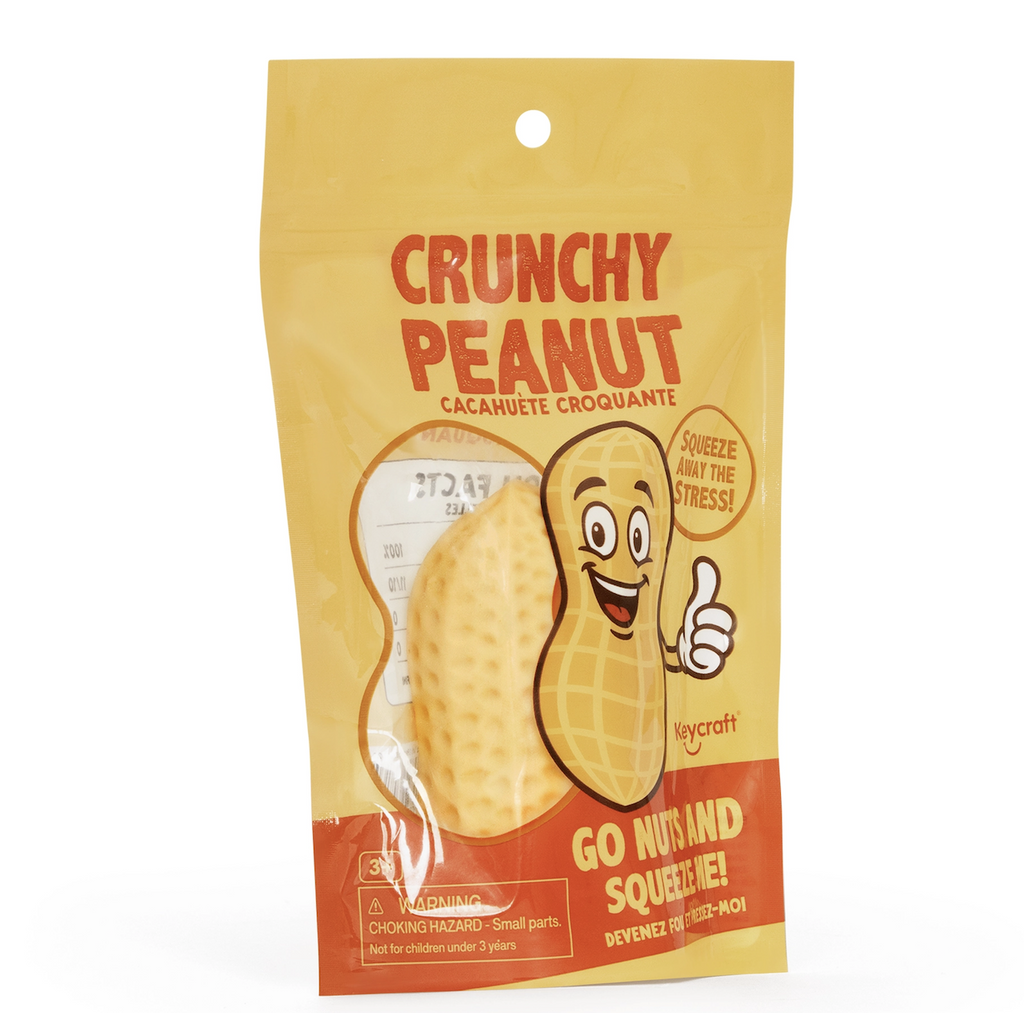 The Crunchy Peanut Squishy packaged in a bag with snack themed graphics and a window that allows you to take a peak at the sand filled squish toy inside. 