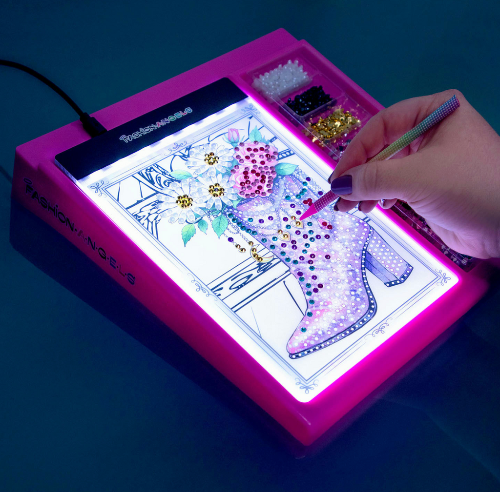 The pink light up pad from the Gem Studio with an acetate design sheet with gems added. 