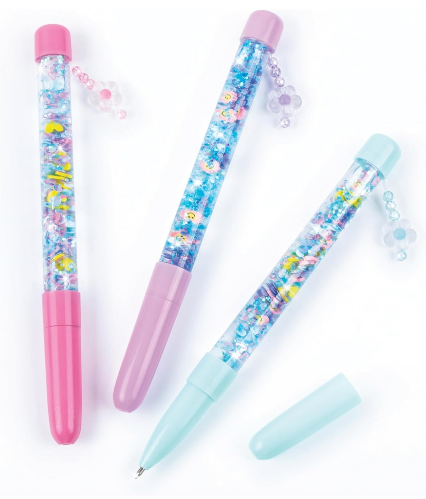 Three gel pens filled with glitter and colorful confetti that have charms attached to the tops of the pens. There is a pink, purple, and light blue pen each with a see through barrel to be filled with your choice of confetti and glitter. 